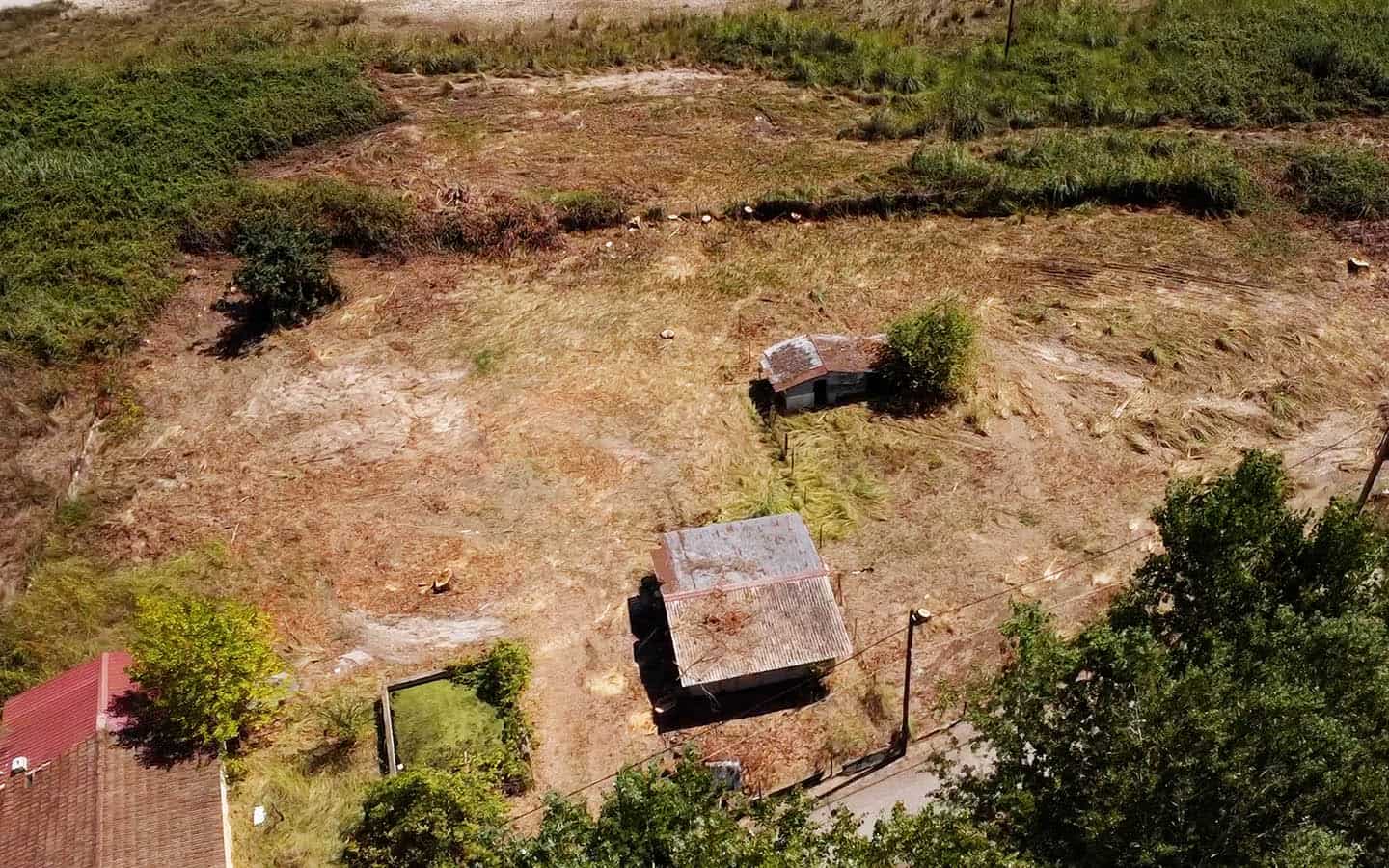 DJI_0014.MP4.00_02_11_51.Still033 copy Προβατίδης μεσιτικό Παραθαλάσσιο αγροτεμάχιο στην Γρίτσα θέα από ψιλά στα χτίσματα